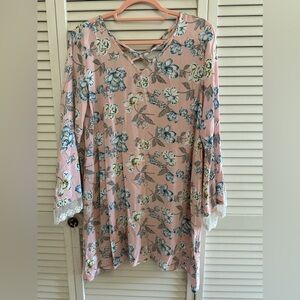 Hassles N Lace Floral tunic with lace trim flare sleeves. Neckline cross straps.